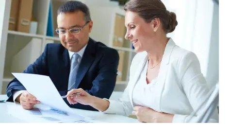 A Peggy's advisor reviewing tax documents with a client
